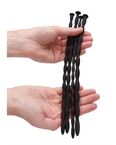 a person holding Silicone Spiral Screw Advanced Urethral Sounding Plugs in 4 Sizes
